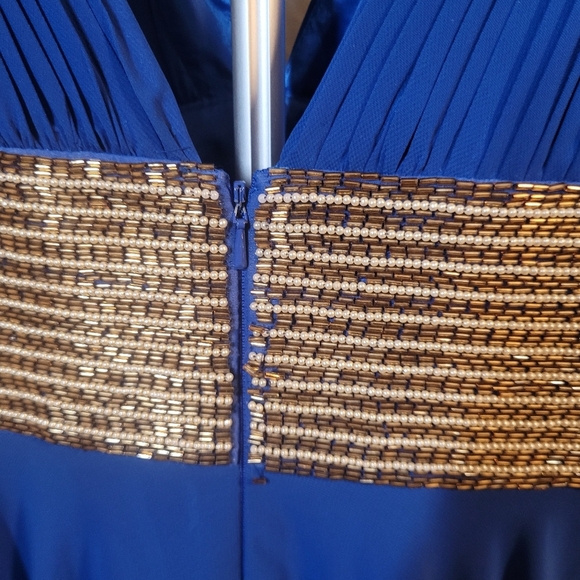Elegant Blue Evening Gown with Gold Beading by Scala - Picture 7 of 16
